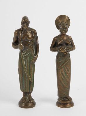 pair of bronze figurines of a woman and a man