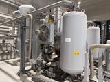 a large industrial water treatment unit with pipes and valves