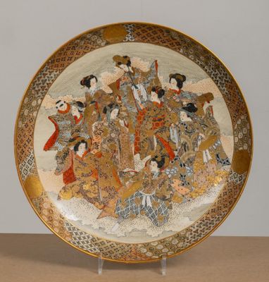 a plate with a picture of a group of people on it