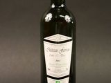 a bottle of wine that is sitting on a table