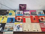 a table that has a lot of books on it