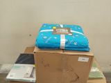 boxes stacked on top of each other on a cart in a room