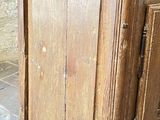 an old wooden cabinet on the floor in a room