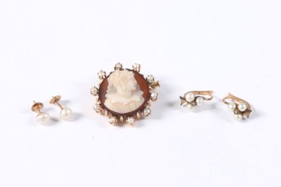 three pieces of jewelry including a ring, earrings, and a broochle