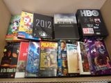 a box full of movies and dvds in it