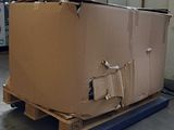 a large cardboard box on a pallet in a warehouse