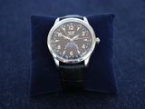 a watch that is sitting on top of a blue pillow