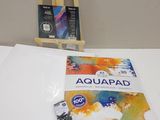 a picture of a book on a table next to a easel