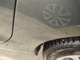 a close up of a car ' s tire on the street