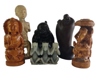 four figurines of different shapes and sizes on a white background