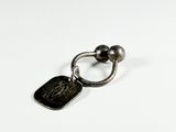 an image of a silver ring with a coin on top of it