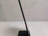 a tablet that is sitting on a stand on a table