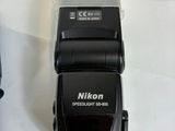 a camera flash that is sitting next to a charger
