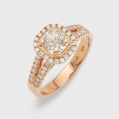 a close up of a diamond ring with a diamond center