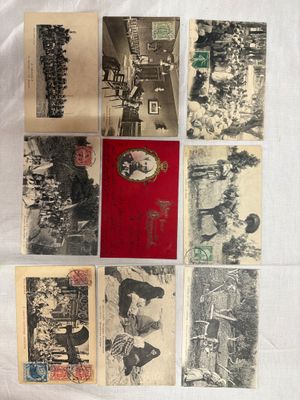 an assortment of old postcards are displayed on a white surface