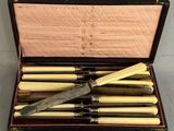 a box with a set of knives inside of it