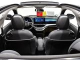 the interior of a small car with four seats and a dashboard