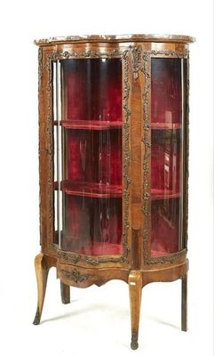 a wooden cabinet with glass doors and a red glass door