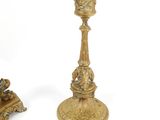 pair of antique brass candlesticks with cherensils on bases