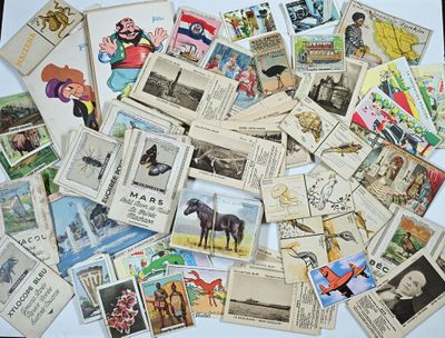a pile of old postcards that are on a table