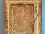 an old wooden picture frame with a rope hanging from it ' s side