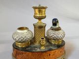 three vases sitting on top of a wooden stand