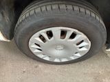 a close up of a tire on a car ' s rim