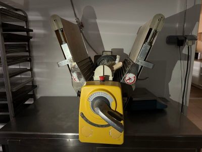 a yellow toaster sitting on top of a black counter