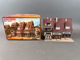 a close up of a box with a model of a house in it