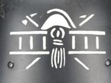 a black and white drawing of a skull and a building