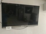 a flat screen tv mounted on a wall in a room