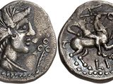 a close up of a coin with a horse and rider on it