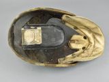 a gold glove that has a cell phone in it