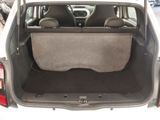 the back of a car with the trunk open and the seats folded down