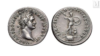 a silver coin with an image of a man holding a sword