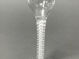 a wine glass that is sitting on top of a table