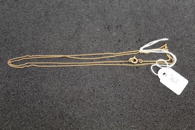 a close up of a gold chain with a tag on it