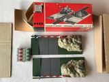 a box with a toy train on it next to a cardboard box
