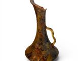 a brown pitcher with a handle on a white surface