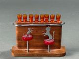 a wooden stand with glasses and a cat on it