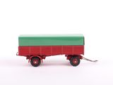 green and red toy truck on white background with keychain
