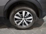 a close up of a car ' s wheel on a tile floor