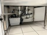 a picture of a kitchen with a sink and a lot of pipes