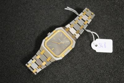 une montre-bracelet en argent et en or, munie d'une étiquette