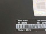 the back of a laptop with a barcode on the screen