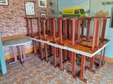 a lot of chairs that are stacked on top of each other