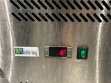 a close up of a metal box with a clock on it