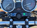 a close up of a motorcycle with a speedometer and gauges on it