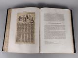 an open book with a picture of a group of people on it