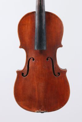 an old violin with a bow hanging from it ' s back